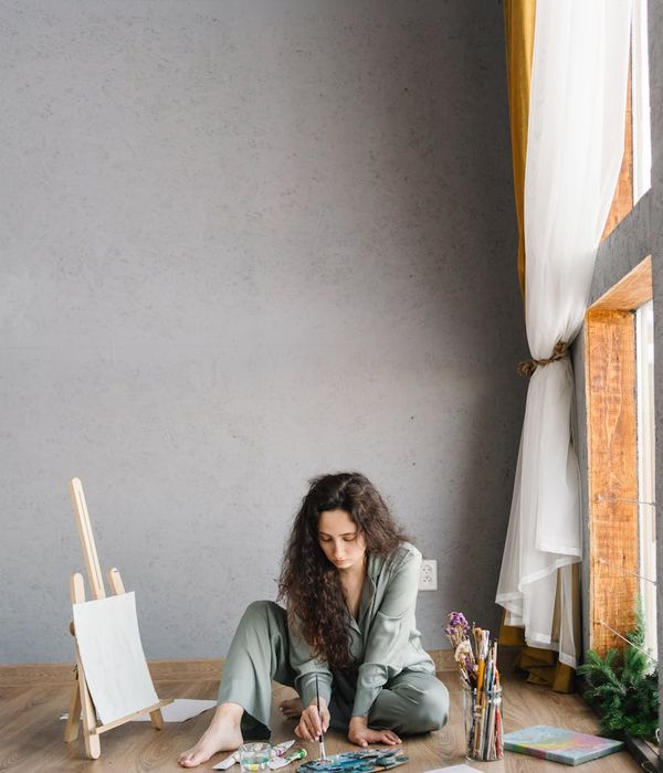 Woman feeling energized and happy in a bright, open space.
